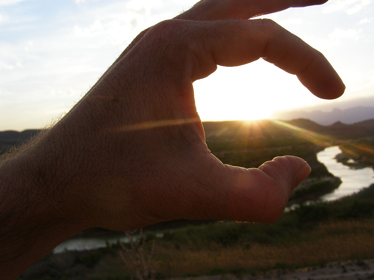 Arthur circles the sun with his fingers.