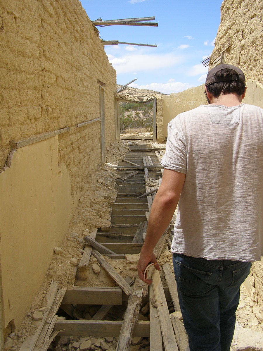 Arthur walking on a precarious floor of an abandoned school.