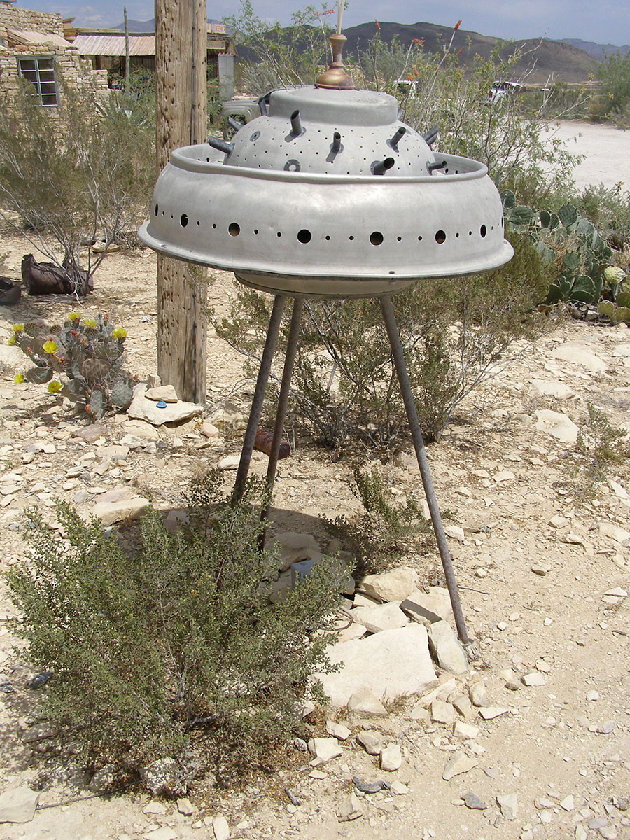 Sculpture of a UFO made with scrap metal and odd parts.