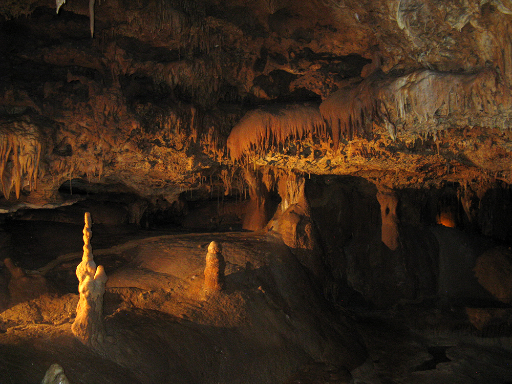 Cave with stalactites and -mites.