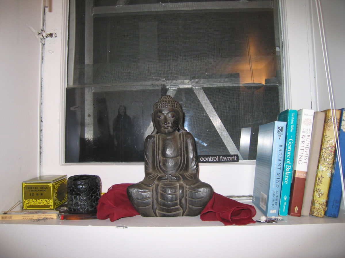 Buddha statue in the window well