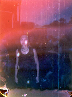 Meg in a smear of red light