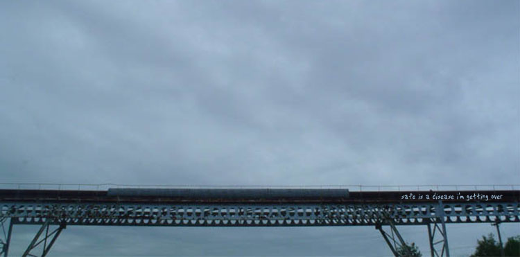 Photo of a rickety train bridge with text, "save is a disease I'm getting over."