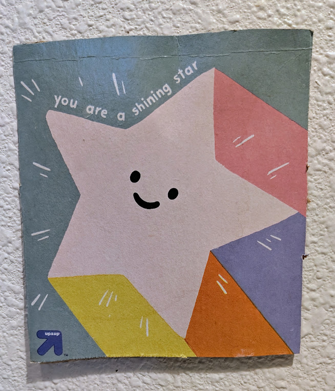 A cartoon star with the words, You are a shining star and the Target Up & Up logo.