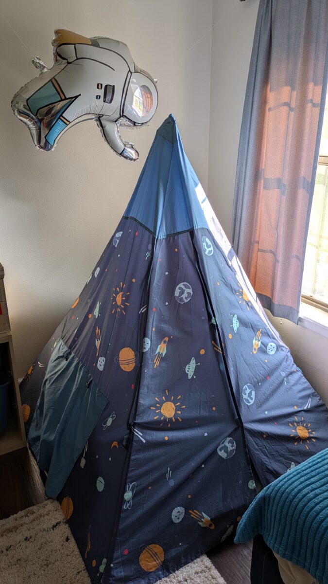 A kid's play tent from Target with an astronaut balloon.