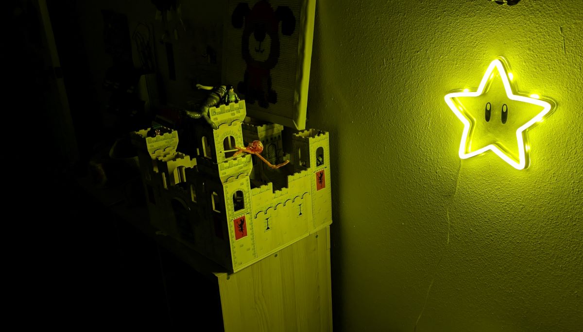 A glowing Super Mario star in an otherwise dark room.